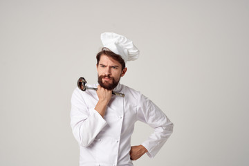 male cook with a ladle