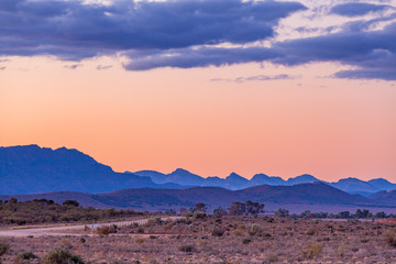 Fototapeta premium Layers of rugged mountain peaks of Flinders Ranges in South Australia at dusk