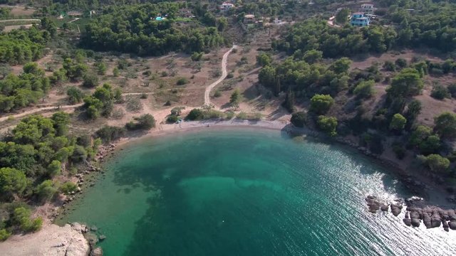 Aerial shot of a beach in Tzemi village of the region Ermionida near Porto Cheli in Greece. Small beautifull beach with turquoise water view from above.