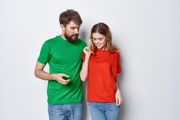 Fototapeta premium woman man in colored t-shirt logo