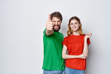 young couple in colored t-shirts