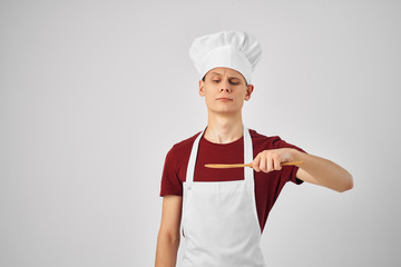 cook cooks with a spoon to eat