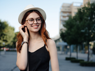 woman with hat glasses on the street