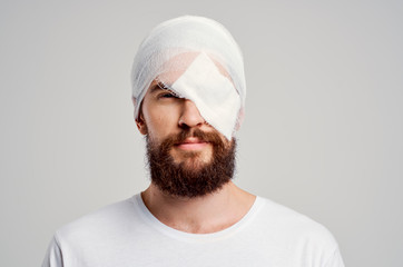 man with a bandage on his head