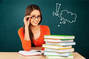 Young beautiful woman in red sweater reading