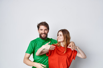 Fototapeta premium young couple in colored t-shirts