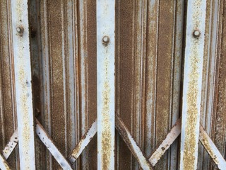 Vintage sliding steel door, old and rust.