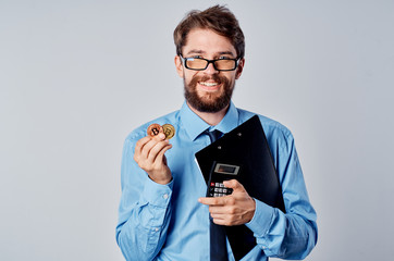 man holds bitcoin in his hand