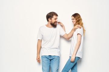 young couple laughing in white t-shirts