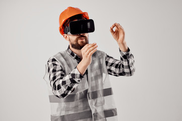 builder in a helmet in 3d glasses