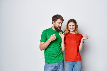 Fototapeta premium young couple in colored t-shirts