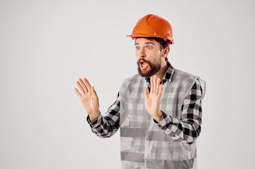 builder in a helmet with emotions on his face