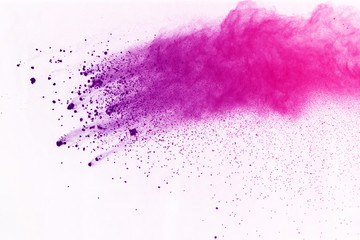 Freeze motion of colored powder explosion isolated on black background. Abstract of Multicolor dust...