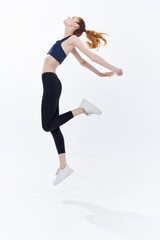 young woman jumping in the air sport yoga fitness