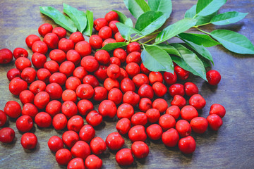 ripe cherries on a wooden background