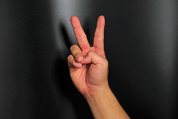 Man hand sign isolated on back background