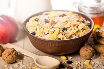Raw oats in bowl and fruit