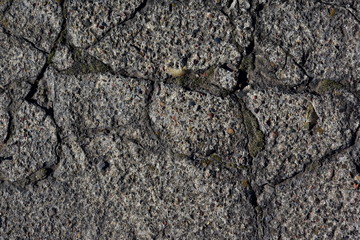 Grey grunge textured wall. set of coarse large cracks