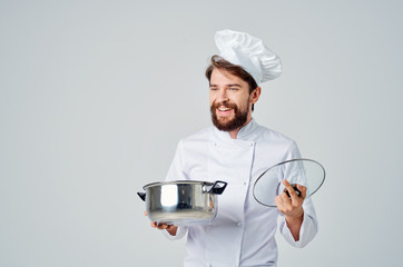 cook man smiling holding pan