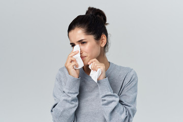 a woman in a gray jacket flies into a handkerchief
