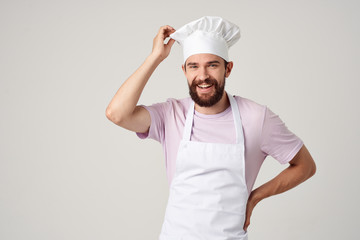 man in a pink tank top with hat and vest