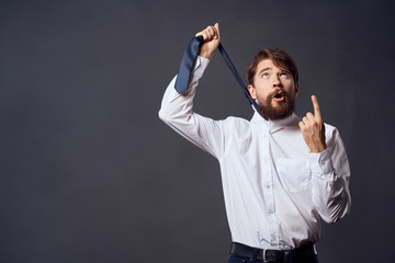 a man shows his index finger, hang himself on a tie