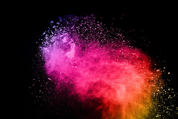 abstract colored dust explosion on a black background.abstract powder splatted background,Freeze...