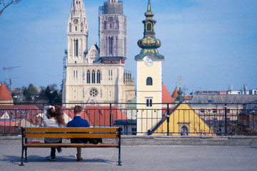 Sitting Young Couple Overlooking City