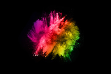 abstract colored dust explosion on a black background.abstract powder splatted background,Freeze motion of color powder exploding/throwing color powder, multicolored glitter texture.