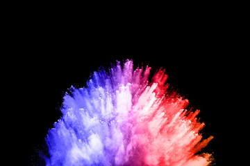 abstract colored dust explosion on a black background.abstract powder splatted background,Freeze motion of color powder exploding/throwing color powder, multicolored glitter texture.