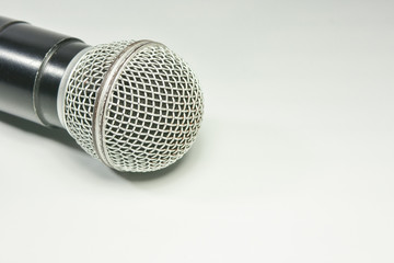 Microphone on the book with White. background. Call center service operator empty working place.