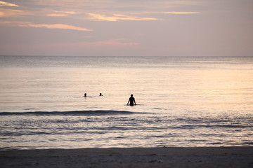People stood watching the sea, Sunrise and happy