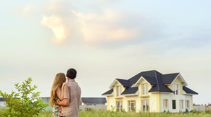 loving couple looking at their home