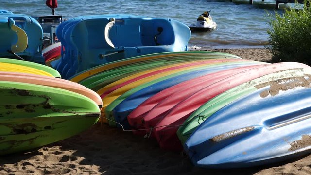 Kayaks stacked on beach Lake Tahoe California