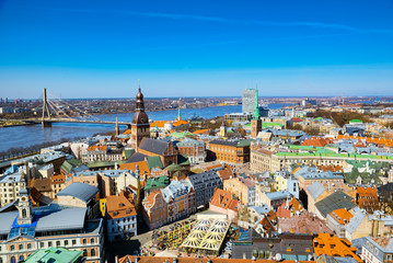 Fototapeta na wymiar Panoramic view of the city of Riga, Latvia from the height of the tower Church of St. Peter