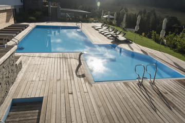 Outdoor pool with wooden lining.