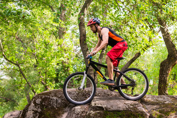 Fototapeta premium Concept of an active lifestyle, a cyclist riding the rocks.