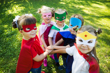 Group kids friends  Superhero playing togetherness and having fun outdoor..