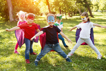 Group kids friends  Superhero playing togetherness and having fun outdoor..