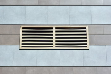 fragment modern industrial building facade and ventilation grille