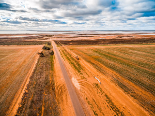 Fototapeta na wymiar Straight gravel road leading to Lake Tyrrell in Victoria, Australia