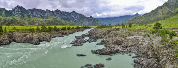 Fototapeta na wymiar Panorama of mountain summer landscape of fast river Katun with Teldykpen rapids, Altai mountains, Russia. This is the narrowest and deepest place of river - harsh beauty of nature 