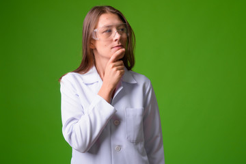 Young beautiful woman doctor wearing protective glasses