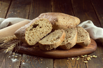 baked bread on wooden table background