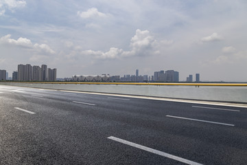 Panoramic skyline and modern business office buildings with empty road,empty concrete square floor