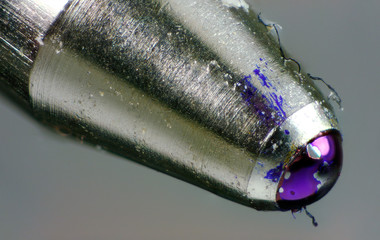 Extreme macro photo of the tip of a ballpoint pen.