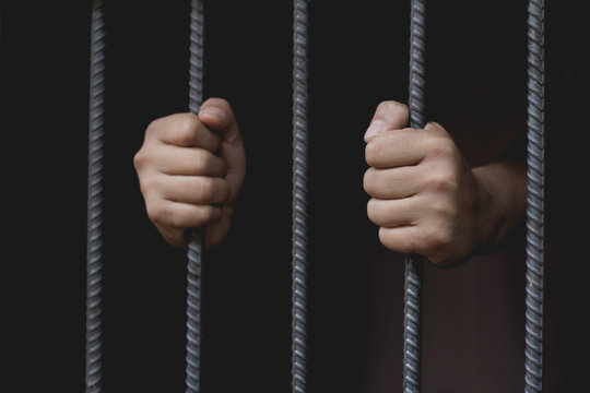 The man was imprisoned in a steel cage, prisoner concept, Hope to be free.