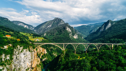 Aerial View of Durdevica Tara Arc Bridge in the Mountains, One of the Highest Automobile Bridges in Europe. - 216088887
