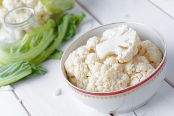 Organic cauliflower on wooden background