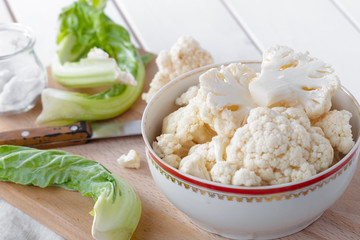 Organic cauliflower on wooden background